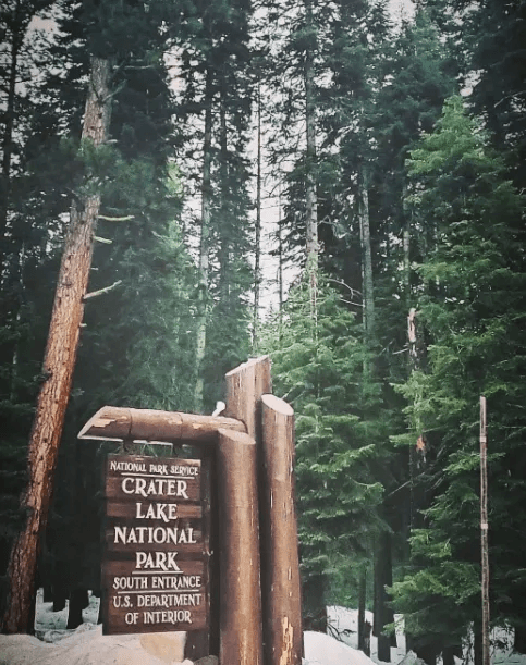 Crater Lake National Park entrance sign — 7 miles from Crater Lake Resort