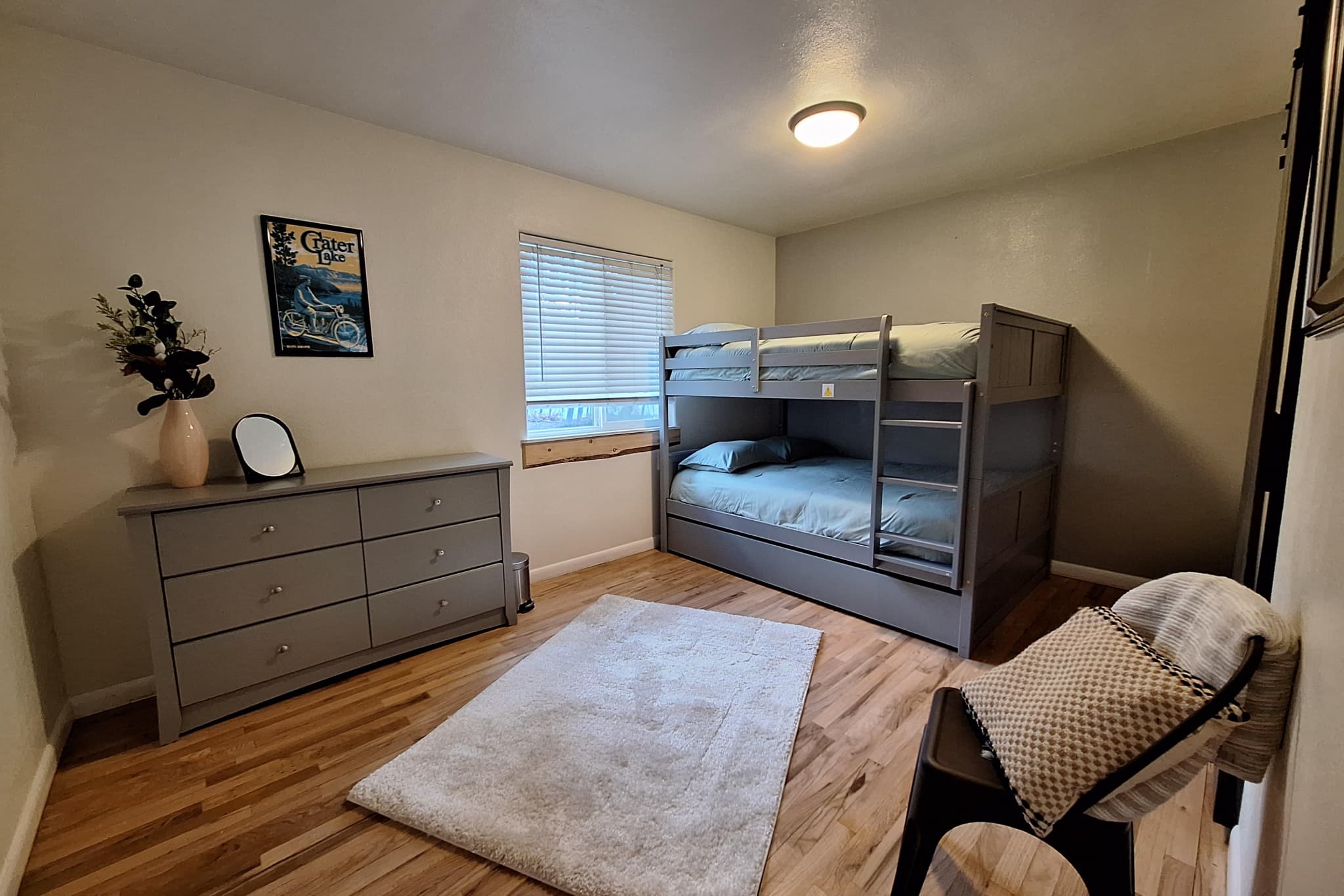 Guest bedroom with full-size bunk bed and pull-out twin trundle